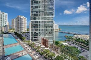an aerial view of a tall building next to the ocean at 2B2B w Water View - FREE Parking - Pool - Lux Spa in Miami