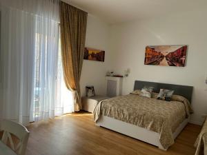 A bed or beds in a room at Casa di Taty B&B