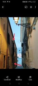 an image of an alley with a view of the ocean at Palazzo Gancia holiday homes in Syracuse