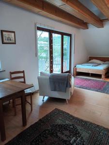 a living room with a couch and a table at Pension Eltmann in Eltmann