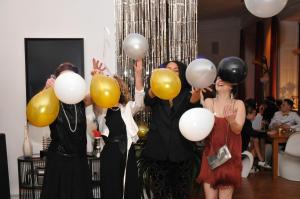 a group of three people holding balloons at Schloss Harkensee in Dassow