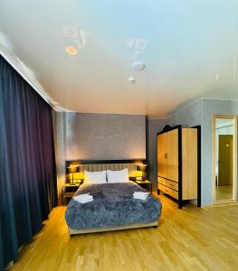 Postel nebo postele na pokoji v ubytování Green Hotel ANG