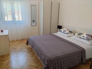 Postel nebo postele na pokoji v ubytování Apartments Podbarje