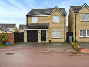 a house with a garage in front of it at Gadebridge in Thornaby on Tees
