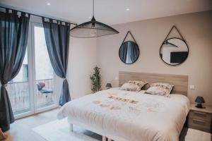 Postel nebo postele na pokoji v ubytování Splendide appartement Cosy