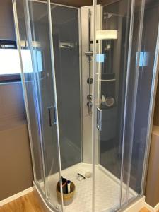 a shower with a glass enclosure in a bathroom at Jumet 242 A Bruxelles-Charleroi-airport in Charleroi