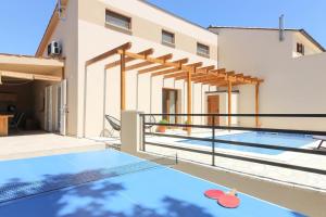 a swimming pool on the balcony of a house at Ferienhaus mit Privatpool für 6 Personen ca 85 qm in Barbariga, Istrien Istrische Riviera in Barbariga