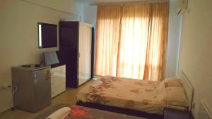 Llit o llits en una habitació de Tangra Guest House