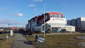 a building with a bench in front of it at Fehmarn-Sonne-Meer in Burgtiefe auf Fehmarn 