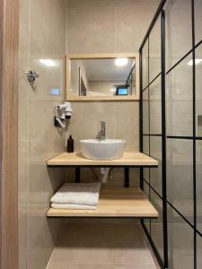 a bathroom with a sink and a mirror at Dalaman Airport AliBaba Hotel in Dalaman +84 photos