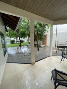 an empty patio with two chairs and a table at Casa Sales - Alter do Chão in Santarém