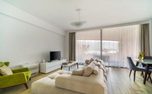 a living room with a couch and a table at Amare Luxury Apartments in Budva
