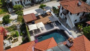 an overhead view of a house with a swimming pool at Tomsan Suites & Villas Akyaka in Akyaka