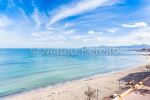 a view of a beach with the ocean at Ferienwohnung in Son Baulo mit Grill in Can Picafort