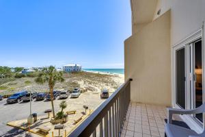 a balcony with a view of the beach at Beachfront Panama City Condo with Balcony and Views! in Panama City