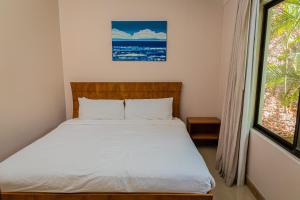 A bed or beds in a room at Villa Escondinte de Playa