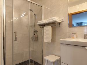 a bathroom with a shower and a sink at CASA do AÇÔR in Aldeia das Dez +38 photos