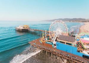 an amusement park with a ferris wheel and a pier at 15 mins to Venice Beach, LAX and Private Parking in Los Angeles