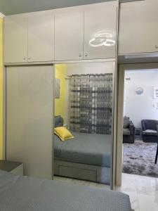 Postel nebo postele na pokoji v ubytování Theofilos apartment