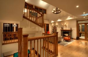 a living room with a staircase and a fireplace at Annabelle - Vacation STAY 28455v in Niseko