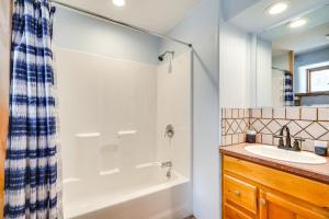 a bathroom with a tub and a sink at Adobe St David Vacation Rental Near River! 