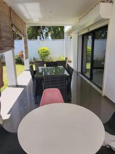 a view of a patio with a table and chairs at Villa Vielet Lalovina in Mahajanga