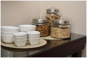 a shelf with three jars of food on it at Be At Home Guesthouse in Klerksdorp