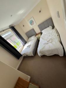 Ένα ή περισσότερα κρεβάτια σε δωμάτιο στο Atlantic Hideaway