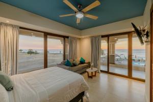 a bedroom with a bed and a view of the ocean at Gran Pacifica Beach Resort & Homes in San Diego +140 photos