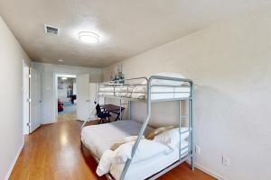 a bedroom with a bunk bed in a room at Quinlan Ranch 