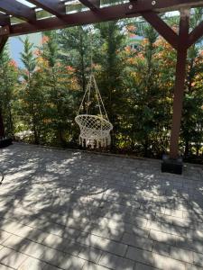 a swing hanging from a gazebo on a patio at Villa Musik - Historical apartments in Baden in Baden