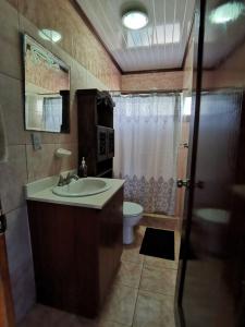 a bathroom with a sink and a toilet and a shower at Costa Rica Beach Sanctuary in Bajamar