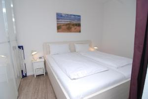 Postel nebo postele na pokoji v ubytování Strandidyll, 102 - Typ B6S + 15 fotografií