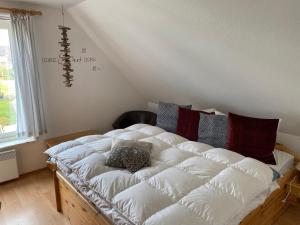 Postel nebo postele na pokoji v ubytování Ferienhaus mit Sauna a & b