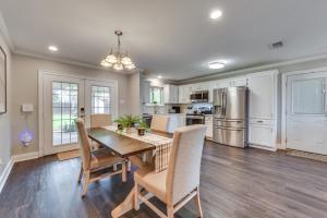a kitchen and dining room with a table and chairs at Baton Rouge Home with Private Patio 2 Mi to LSU! in Baton Rouge