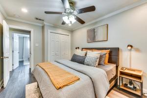 a bedroom with a bed and a ceiling fan at Baton Rouge Home with Private Patio 2 Mi to LSU! in Baton Rouge