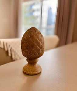 a brown cookie sitting on top of a table at Aptos modernos no Solar Tambaú - 1 e 2 Quartos in João Pessoa