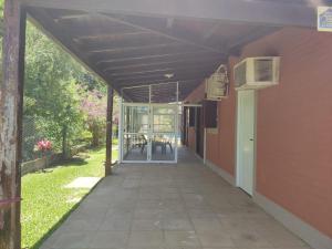 an empty hallway of a building with an open door at Casa de Alquiler in Corrientes