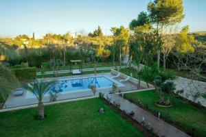 an overhead view of a garden with a swimming pool at Villa Meriem, Fès in Oulad Tayeb