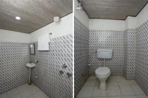 Um banheiro em OYO Flagship Sunrise Inn Guest House