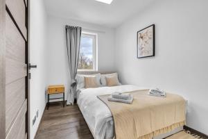 Postel nebo postele na pokoji v ubytování Hotel U Krále Jiřího