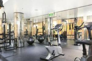a gym with many exercise equipment in a room at One Bedroom Unit at Sydney Best Location in Sydney
