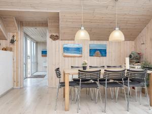 a dining room with a table and chairs at Holiday home Lemvig XII in Lemvig