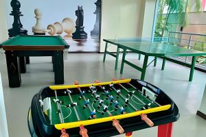 two billiard tables and a table with a pool table at Aptos no Luxor Tambaú próximo ao mar in João Pessoa