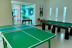 two ping pong tables in a room at Aptos no Luxor Tambaú próximo ao mar in João Pessoa