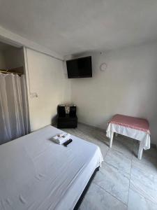 TV a/nebo společenská místnost v ubytování Hosteria Puerta del Nus