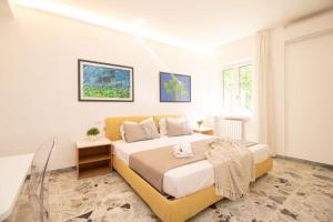 a bedroom with a large bed in a room at [Sea View] Appartamento Panoramico Wifi A/C in Porto San Giorgio