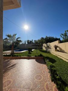 a walkway in a park with a street light at Stunning 3-Bed Villa in Fes near fes sais airport in Fès