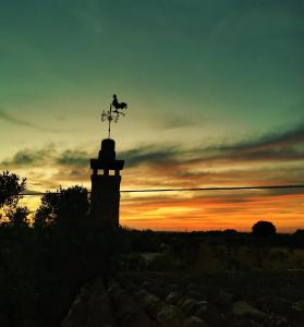 The sunrise or sunset as seen from a panziókat or nearby