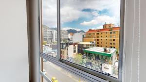 a view of a city street from a window at Your Home in the Heart of Bogotá in Bogotá